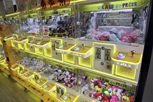 Prints of Claw Express claw machine arcade game with prizes, Hong Kong, China Hong Kong Images: Claw Express claw machine arcade game with prizes, Hong Kong, China