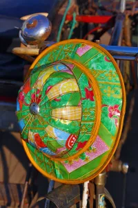 Rangoon: Colourful hat hanging on a bicycle, Yangon, Myanmar