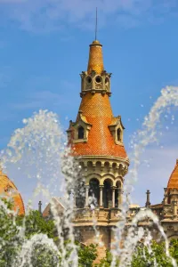 Place: Fountain in the Placa de Catalunya and turret roofs of buildings in the Passeig de Gracia in Barcelona
