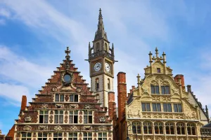 Architecture: Ghent clock tower and the Vrije Schippers Guildhall, Graslei quay, Ghent, Belgium