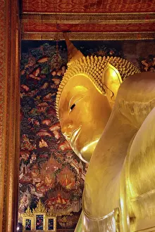 Statues: Giant gold reclining Buddha statue at Wat Pho Temple in Bangkok, Thailand