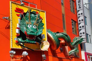 Shops: Giant green dragon advertising sign in Dotonbori, Osaka, Japan