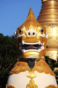 Entrance: Giant lion statue at the entrance of the Shwedagon Pagoda, Yangon, Myanmar