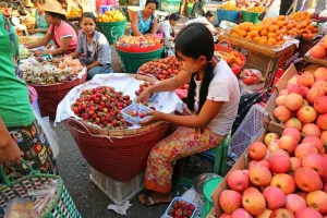 Stalls: Girl selling strawberries in a street market, Yangon, Myanmar