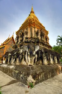 Golden: Gold chedi decorated with elephants in Wat Chiang Man Temple in Chiang Mai, Thailand