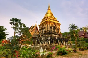 Gold chedi decorated with elephants in Wat Chiang Man Temple in Chiang Mai, Thailand
