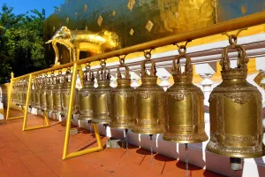 Chiang: Gold elephant statue and bells on the chedi at Wat Phra Singh Temple in Chiang Mai