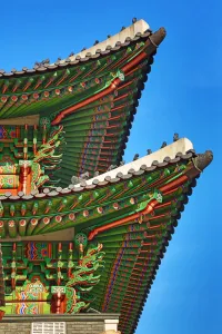 Seoul, Korea: Green wooden roof beams of the Gwanghwamun Gate at Gyeongbokgung Palace in Seoul, Korea
