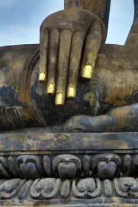 Wonders Of Thailand: Hand on a Buddha statue at Wat Mahathat temple, Sukhotai, Thailand