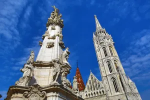 Statues: Holy Trinity Column and the Matthias Church in Budapest, Hungary