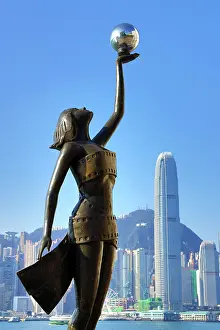 Prints of The Hong Kong Film Awards Statue, of a Goddess holding a Pearl, in front of Victoria Harbour, Hong Kong, China. The statue embodies the artistic and cultural endeavour of the Hong Kong film industry Hong Kong Images: The Hong Kong Film Awards Statue