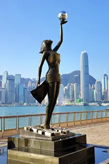 Prints of The Hong Kong Film Awards Statue, of a Goddess holding a Pearl, in front of Victoria Harbour, Hong Kong, China. The statue embodies the artistic and cultural endeavour of the Hong Kong film industry Hong Kong Images: The Hong Kong Film Awards Statue