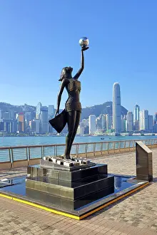 Prints of The Hong Kong Film Awards Statue, of a Goddess holding a Pearl, in front of Victoria Harbour, Hong Kong, China. The statue embodies the artistic and cultural endeavour of the Hong Kong film industry Hong Kong Images: The Hong Kong Film Awards Statue