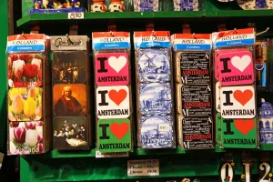 Tourism: I love Amsterdam souvenir coasters for tourists on sale at a souvenirs stall at the Flower Market in Amsterdam