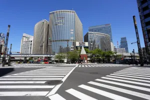 Road: Japanese street scene of modern buildings and a pedestrian crossing in Ginza, Tokyo, Japan