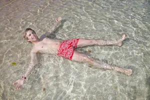Vacation: Man lying in the sea on holiday