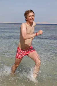 Vacation: Man running in the sea