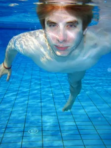 Pools: Man swimming underwater in a swimming pool