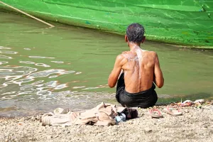 Burma: Man washing in the Ayeryarwaddy River in Old Bagan, Bagan, Myanmar (Burma)
