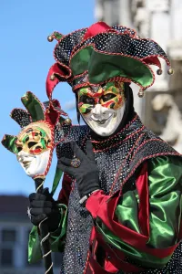 Venice Carnival: Man wearing a jester mask and costume at the Venice Carnival