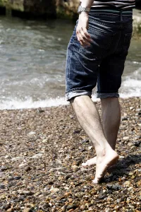 Editor's Picks: Man wearing striped T shirt on holiday at the seaside on the beach