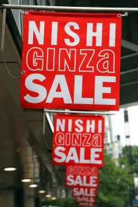 Tokyo, Japan: Nishi Ginza Sale signs advertising shop sales in Ginza, Tokyo, Japan
