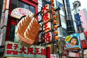Shops: Osaka Ohsho restaurant with giant gyoza dumplings sign in Dotonbori, Osaka, Japan