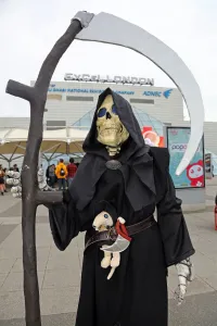 Cosplayers: A participant dressed up as Death from the Terry Pratchett novels with the Death