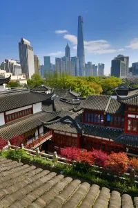 Ancient: The Pudong city skyline in Shangha in the background of the Yuyuan gardens in the Old City