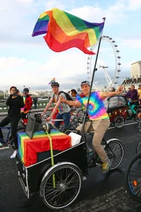 Flags: Rainbow flag and Ride with Pride bicycle ride for London Pride