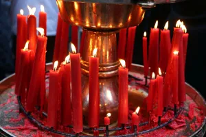 Taiwan: Red candles burning at the Longshan Buddhist Temple at Chinese New Year in Taipei, Taiwan
