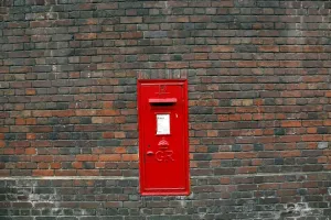 Pillar: Red English Post Box in a brick wall