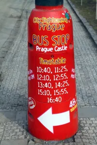 Stock Geography: Red Prague Castle city sightseeing bus stop