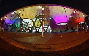 Center: The roof of Dadong Arts Centre illuminated at night in Kaohsiung, Taiwan