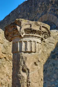 Ruined pillar in the ancient Roman city of Pompeii, Italy
