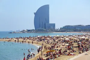 Beaches: Scene of holiday crowds on the crowded beach and the W hotel, Barcelona, Spain