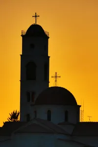 Amman And Jordan: Silhouette of the Greek Orthodox Church dome and tower at sunset in Amman, Jordan