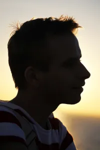 Head: Silhouette of the portrait of a man at sunset