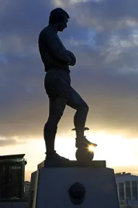 Silhouettes: Silhouette of the statue of Bobby Moore at Wembley Stadium, London, England
