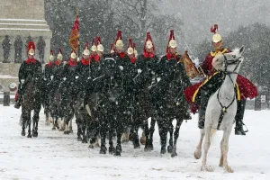 Snow spooks horse at the Changing of the Queens Life Guards, London