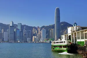 Prints of Star Ferry leaving Tsim Tsa Shui terminal and crossing Victoria Harbour with the city skyline in Hong Kong, China Hong Kong Images: Star Ferry leaving Tsim Tsa Shui terminal and crossing Victoria Harbour with the city skyline in Hong Kong
