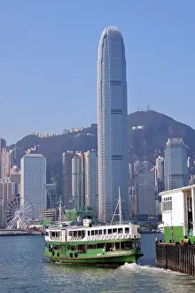 Prints of Star Ferry leaving Tsim Tsa Shui terminal and crossing Victoria Harbour with the city skyline in Hong Kong, China Hong Kong Images: Star Ferry leaving Tsim Tsa Shui terminal and crossing Victoria Harbour with the city skyline in Hong Kong