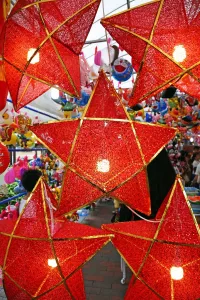 Illuminations: Star shaped red lanterns in a street market in Chinatown in Singapore