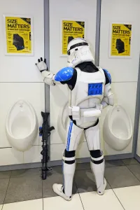 MCM London Comic Con: A Star Wars Stormtrooper takes a loo break in the toilet at MCM London Comic Con