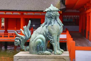 Hiroshima, Japan: Stone lion statue at Itsukushima Shinto Shrine on Miyajima Island, Hiroshima, Japan