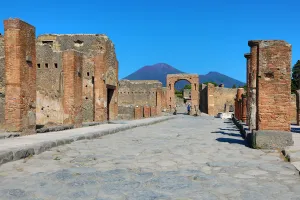 Street and ruins of houses in the ancient Roman city of Pompeii, Italy