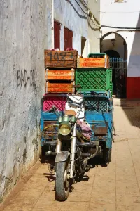 Africa: Street scene with a loaded motorcycle in the Medina of Rabat, Morocco