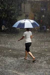 People: Street scenes in the rainy season in Hanoi, Vietnam