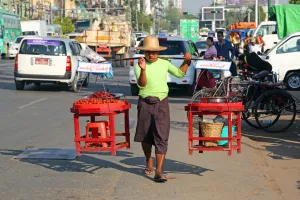 Carrying: Street seller carrying wares on his shoulders, Yangon, Myanmar
