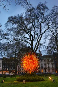 Modern: The Sun glass sculpture by Dale Chihuly comes out at night in Berkeley Square, London